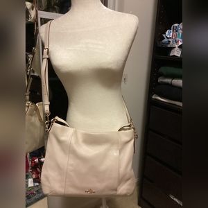 Coach leather hobo bag with detachable crossbody strap.
